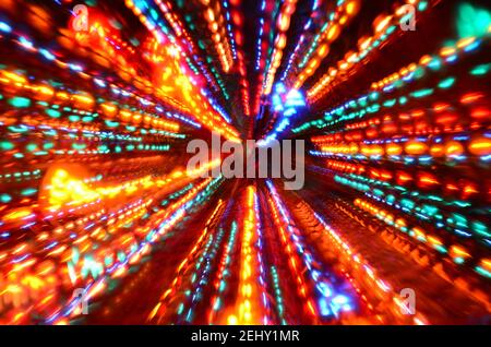 Multi-colored explosion of lights on dark background Stock Photo