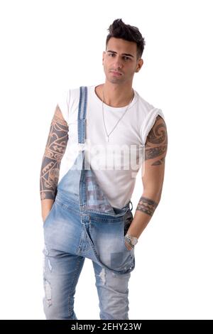 Young man wearing denim overalls and white t-shirt Stock Photo