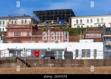 Roof scaffolding on a large seafront building, hastings, east sussex, uk Stock Photo