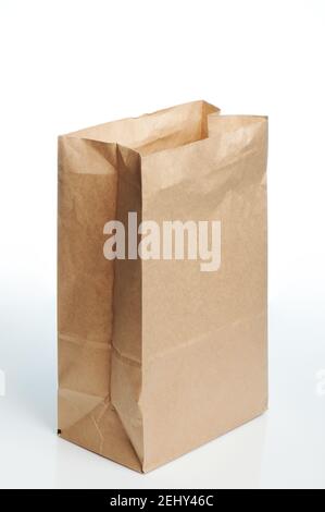 Tall brown open paper bag isolated on white studio background Stock Photo