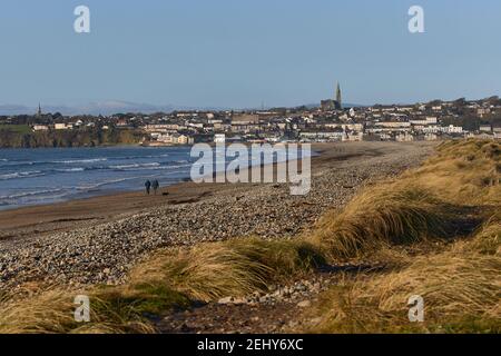 Irish beach with city in the background with Catholic church on top of the mountain. Tramore nature reserve. Waterford. Ireland. landscape Stock Photo