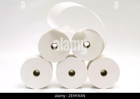 Closeup of stacked paper rolls on white background, France Stock Photo