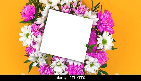 White invitation mockup with bouquet of flowers on yellow background, card concept photo Stock Photo