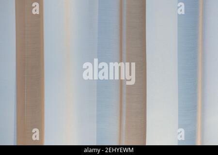 Soft color fabric background with vertical brown and blue stripes. Abstract textile. Stock Photo