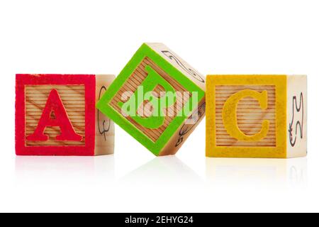 Three children's wood blocks on white with letters A, B and C Stock Photo