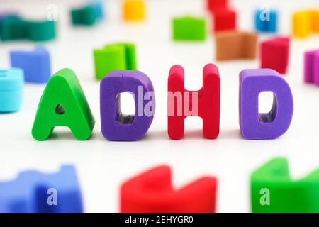 ADHD. The abbreviation ADHD made out of polymer clay letters. Close up. ADHD is Attention deficit hyperactivity disorder. Stock Photo