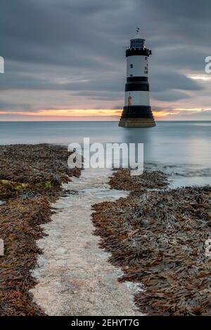 Penmon Point lighthouse at dawn, Anglesey, North Wales Stock Photo
