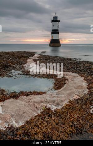 Penmon Point lighthouse at dawn, Anglesey, North Wales Stock Photo