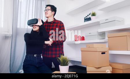 Couple using 3d simulation to view design of new appartment. High quality photo Stock Photo