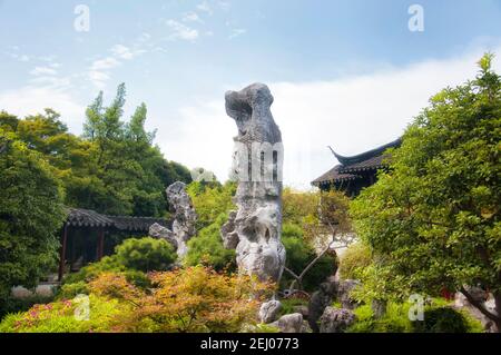 a large rock formation at the lingering garden in Suzhou china on a sunny day in Jiangsu Province. Stock Photo