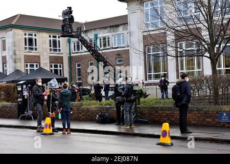 Location filming of Alex Rider story rehearsals, cameraman on crane platform, crew preparing for outdoor shoot at Brookland School for Amazon Prime Stock Photo