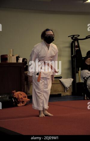 This action photo is of my daughter in her Karate class. Karate is a martial art that focuses on self-discipline and fitness. Stock Photo