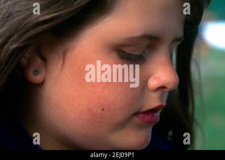 Portrait of Nine Year Old Girl looking Worried Stock Photo
