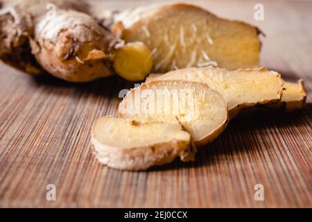 View of ginger slices. Ginger is well known food used in home remedies for flu and boosts immunity Stock Photo