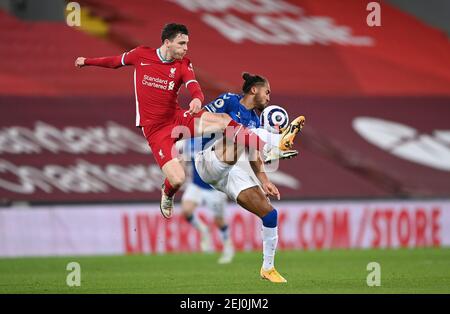 Liverpool's Andrew Robertson (left) and Everton's Dominic Calvert-Lewin battle for the ball during the Premier League match at Anfield, Liverpool. Picture date: Saturday February 20, 2021. Stock Photo