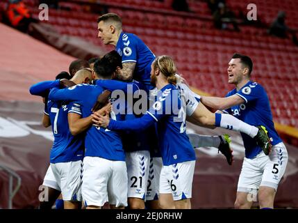 Everton's Richarlison (left) celebrates with his team-mates after scoring their side's first goal of the game during the Premier League match at Anfield, Liverpool. Picture date: Saturday February 20, 2021. Stock Photo