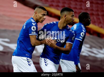 Everton's Richarlison (left) celebrates with his team-mates after scoring their side's first goal of the game during the Premier League match at Anfield, Liverpool. Picture date: Saturday February 20, 2021. Stock Photo