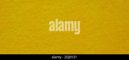 High resolution close up of bright yellow felt fabric. Yellow felt texture. Stock Photo
