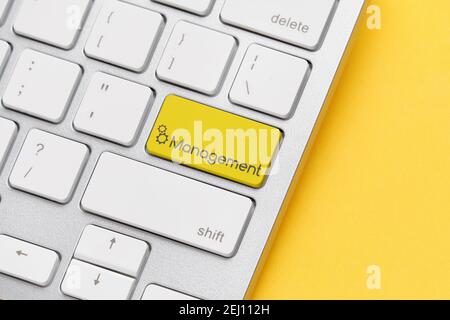 Online management concept on keyboard button. Close up. Stock Photo