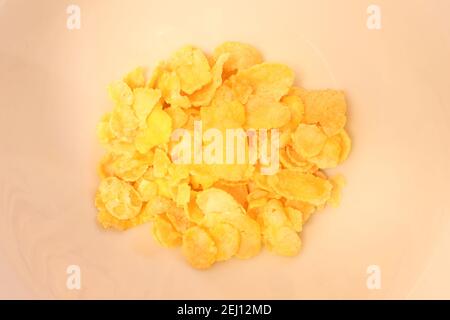 Closeup of cornflakes in a bowl without the edges. Stock Photo