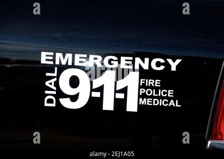 Henstridge, Somerset, UK - August 24 2019: An Emergency Dial 9-11 sticker on an American Police car Stock Photo