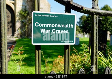Bishopstrow, Warminster, Wiltshire / UK - September 13 2020: A Commonwealth War Graves sign at Bishopstrow Church, Warminster, Wiltshire, England, UK Stock Photo
