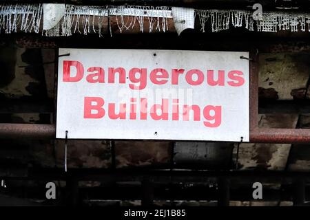 Warminster, Wiltshire / UK - November 10 2019: A dangerous building warning sign Stock Photo