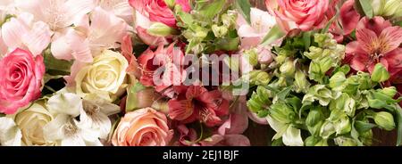 Flowers border composition. Alstroemeria Flowers, roses. Flat lay top view Stock Photo