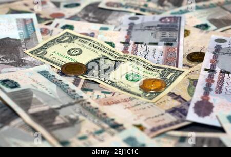 egypt-national-currency-with-usa-dollar-banknote-backdrop-egyptian-pounds-money-and-american-dollars-exchange-rate-2ej1c1c.jpg