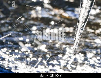 Frozen icicle spikes above a stream with water sprites due to a slow ...