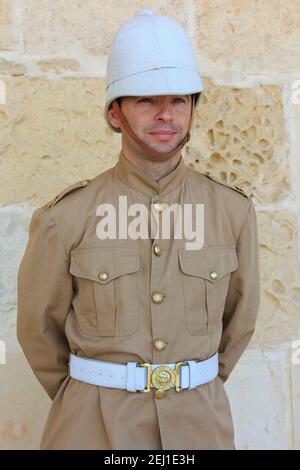 Soldier at the Saluting Battery of the Upper Barrakka Gardens in Valletta, Malta Stock Photo