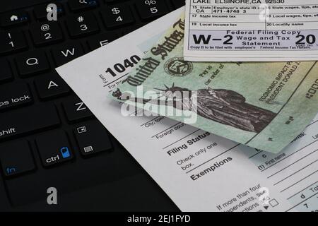 US IRS Internal Revenue Service income tax filing form 1040 with supporting documents. Stock Photo