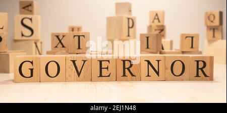 The word governor is from wooden cubes. Economy state government terms. Stock Photo