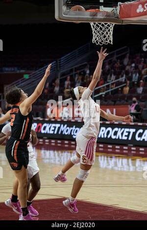 Southern California Trojans guard Endyia Rogers (4) scores on a layup against Oregon State Beavers guard Talia Von Oelhoffen (22) during an NCAA women Stock Photo