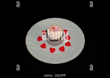 Strawberry and Chocolate Cupcake on a White Plate Stock Photo