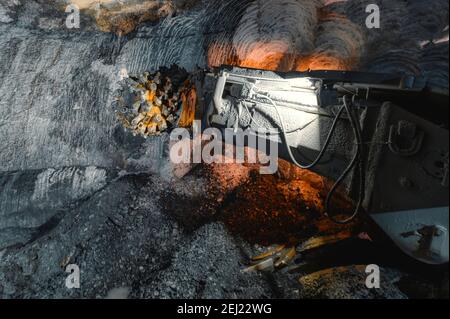 Drilling head of a mine roadheader. Underground mining of ore deposits Stock Photo