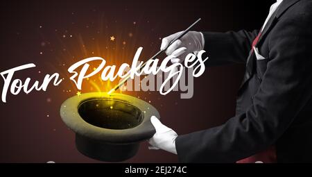 Magician is showing magic trick with Tour Packages inscription, traveling concept Stock Photo