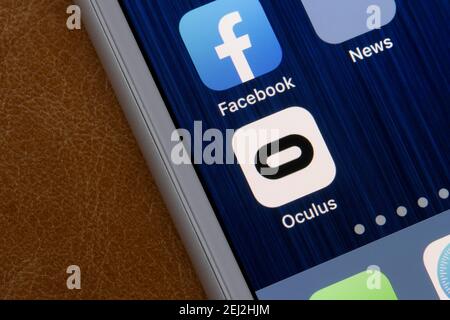 Oculus app icon is seen on an iPhone. Oculus is a brand of Facebook Technologies, LLC, which produces VR headsets, including the Rift and Quest lines. Stock Photo