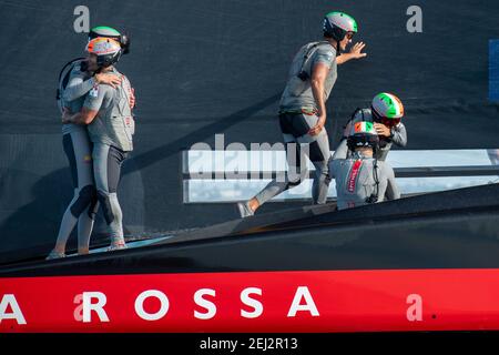 Auckland, New Zealand. 21 February 2021. Prada Cup Finals. Credit Chris Cameron / Alamy Live News. Auckland, New Zealand. 21 February 2021. Prada Cup Finals. Credit Chris Cameron / Alamy Live News. Luna Rossa Prada Pirelli Team sailors congratulate each other after winning the Prada Cup. Credit: Chris Cameron/Alamy Live News Stock Photo