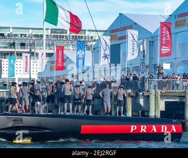Auckland, New Zealand, 21 February, 2021 -  Italian team Luna Rossa Prada Pirelli celebrate their Prada Cup Finals 7-1 win over INEOS Team UK's Britannia on Auckland's Waitemata Harbour. Luna Rossa will go forward to challenge Emirates Team New Zealand in the 36th America's Cup starting on March 6. Photo shows the them returning to their base Credit: Rob Taggart/Alamy Live News Stock Photo