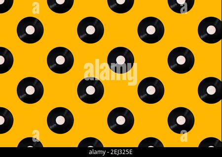 Pattern of vinyl records on a yellow background. Minimal trendy composition Stock Photo