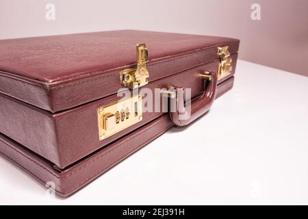 Closed 24 hour briefcase with open lock Stock Photo