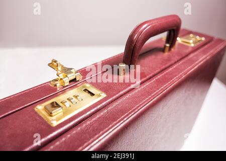 Closed 24 hour briefcase with open lock Stock Photo