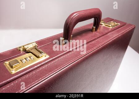 Closed 24 hour briefcase with closed lock on white background Stock Photo