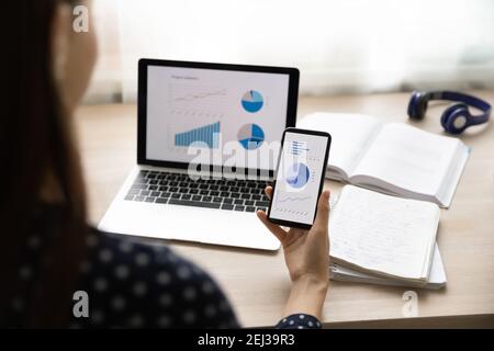 Close up of woman study finances using devices Stock Photo