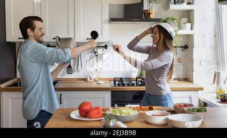 Banner view of happy couple have fun cooking Stock Photo