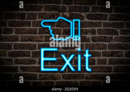 Detail photo of a neon sign on a wall with the inscription Exit Stock Photo