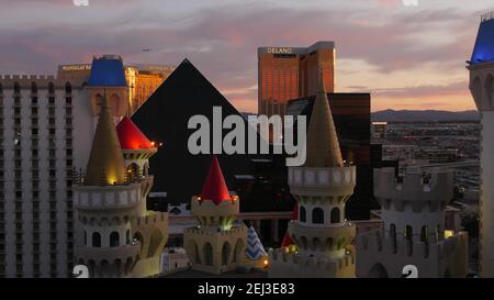 LAS VEGAS, NEVADA USA - 4 MAR 2020: Excalibur castle and Luxor pyramid casino uncommon aerial view. Plane flying from McCarran airport. Mandalay Bay a Stock Photo