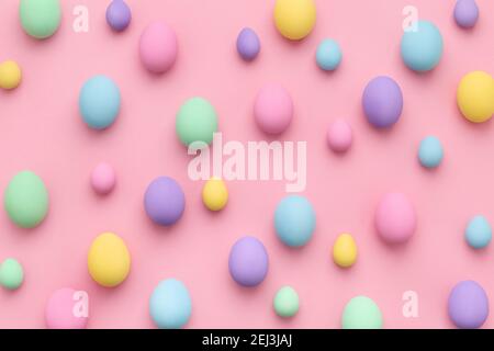 Pastel colored Easter eggs scattered on pink background. Easter Day colorful abstract flat lay. Stock Photo
