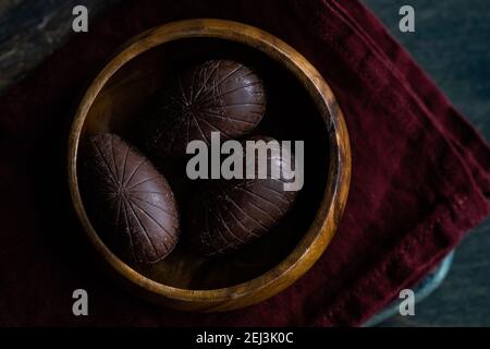 Easter place setting with various chocolate eggs in a bowl Stock Photo
